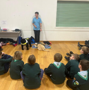 Sandy the retired guide dog meets 69th Bath Cubs